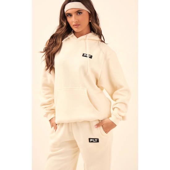 PRETTYLITTLETHING Cream Logo Badge Detail Straight Leg Sweatpants PRETTYLITTLETHING Cream Logo Badge Detail Straight Leg Sweatpants