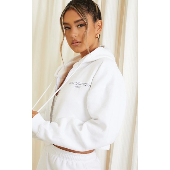 PRETTYLITTLETHING White Copyright Graphic Zip Through Crop Hoodie PRETTYLITTLETHING White Copyright Graphic Zip Through Crop Hoodie